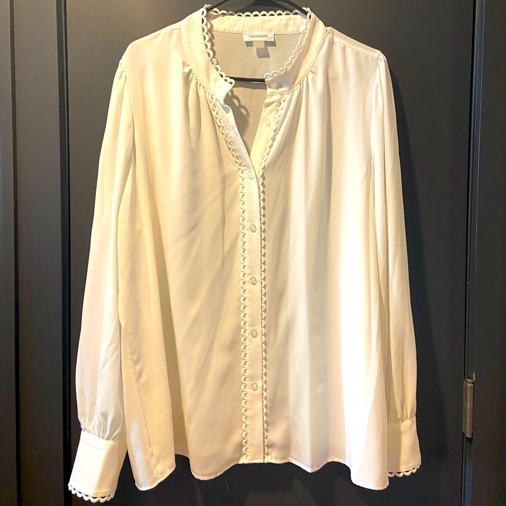 Long-sleeved off-white blouse